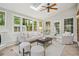 Bright sunroom with skylight, tile floor, neutral furniture, and lots of natural light at 3932 Granger Dr, Brookhaven, GA 30341