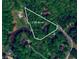 Aerial view showcasing a sprawling 2.99-acre lot surrounded by lush greenery and mature trees at 4703 Waverly Walk, Douglasville, GA 30135