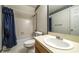 Bathroom featuring classic patterned wallpaper, and a shower with a blue curtain at 4703 Waverly Walk, Douglasville, GA 30135
