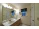Bathroom with a double sink vanity and a large mirror, and coordinated decor at 4703 Waverly Walk, Douglasville, GA 30135