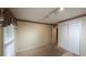 Bedroom with neutral walls, a double closet and light-colored carpeting at 4703 Waverly Walk, Douglasville, GA 30135