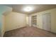 Spacious carpeted bedroom featuring multiple closets, storage, and neutral walls at 4703 Waverly Walk, Douglasville, GA 30135