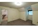 Cozy bedroom with neutral tones, featuring a small window and an ensuite bathroom at 4703 Waverly Walk, Douglasville, GA 30135