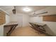 Bright bonus room with work tables and laminate flooring at 4703 Waverly Walk, Douglasville, GA 30135