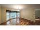 Bright dining room featuring hardwood floors, a bay window, and a chandelier at 4703 Waverly Walk, Douglasville, GA 30135
