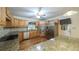 Spacious kitchen featuring stainless steel appliances, wood cabinets, and granite countertops at 4703 Waverly Walk, Douglasville, GA 30135