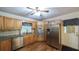 Spacious kitchen featuring stainless steel appliances, wood cabinets, and granite countertops at 4703 Waverly Walk, Douglasville, GA 30135