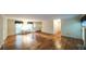 Open-concept living room featuring hardwood floors, natural light, and a fireplace at 4703 Waverly Walk, Douglasville, GA 30135