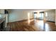 Open living space with hardwood floors, a fireplace, and plenty of natural light at 4703 Waverly Walk, Douglasville, GA 30135