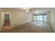 Spacious main bedroom with carpeting, two ceiling fans, a large window and a doorway at 4703 Waverly Walk, Douglasville, GA 30135