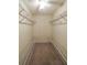 Walk-in closet featuring carpeted floor and shelving on all sides at 4703 Waverly Walk, Douglasville, GA 30135