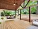 Inviting back porch with a swing and comfortable seating, offering a relaxing outdoor space at 5840 Crabapple Sw Dr, Mableton, GA 30126