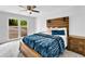 Well-decorated bedroom featuring wood furnishings and an outdoor view at 5840 Crabapple Sw Dr, Mableton, GA 30126