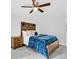 Bedroom with a blue velvet bedspread, wood-look floors and a ceiling fan at 5840 Crabapple Sw Dr, Mableton, GA 30126