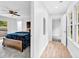 Bedroom with a blue velvet bedspread, wood-look floors and a ceiling fan at 5840 Crabapple Sw Dr, Mableton, GA 30126