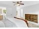 Bedroom featuring a large bed, two doorways, and a dresser with a warm neutral color palette at 5840 Crabapple Sw Dr, Mableton, GA 30126