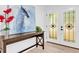 Welcoming entryway with decorative art, leading to a stylish door with star-patterned glass at 5840 Crabapple Sw Dr, Mableton, GA 30126