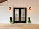 Stylish front door featuring decorative star-patterned glass and modern lighting, adding curb appeal at 5840 Crabapple Sw Dr, Mableton, GA 30126