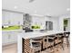 Beautiful kitchen featuring white cabinets, quartz countertops, and barstool seating at 5840 Crabapple Sw Dr, Mableton, GA 30126