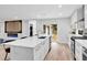 Open concept kitchen with large island, white countertops, and stainless steel sink at 5840 Crabapple Sw Dr, Mableton, GA 30126