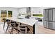 Open kitchen featuring a large center island with barstool seating and stainless appliances at 5840 Crabapple Sw Dr, Mableton, GA 30126