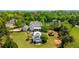 Aerial view of the property highlighting the pool, landscaping, and surrounding greenery at 210 Tifton Ln, Roswell, GA 30075