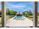 A view from the covered porch towards the pool, lounge chairs and outdoor kitchen at 210 Tifton Ln, Roswell, GA 30075
