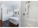 Bathroom featuring a freestanding tub with chrome faucet and tiled shower stall with showerhead at 210 Tifton Ln, Roswell, GA 30075