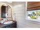 Charming powder room featuring ship lap walls, a vessel sink, and a view of the outdoor pool at 210 Tifton Ln, Roswell, GA 30075