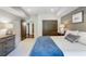 Serene bedroom showcasing plush bed, shiplap accent wall, and ample closet space for relaxation at 210 Tifton Ln, Roswell, GA 30075