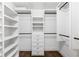 Walk-in closet with custom shelves, drawers, and rods for ample storage and organization at 210 Tifton Ln, Roswell, GA 30075