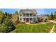Charming two-story home with manicured lawn, lush landscaping, and double front porch at 210 Tifton Ln, Roswell, GA 30075
