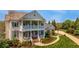 Beautiful home with a two-story porch, walkway, and lush landscaping providing curb appeal at 210 Tifton Ln, Roswell, GA 30075