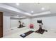 Bright home gym with mirrors, spin bikes, yoga mats, and an exercise ball for optimal fitness at 210 Tifton Ln, Roswell, GA 30075