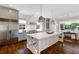 Gourmet kitchen featuring a large center island and stainless steel appliances, ideal for cooking at 210 Tifton Ln, Roswell, GA 30075
