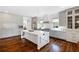 Expansive kitchen with large island, modern appliances, and custom cabinetry for ample storage at 210 Tifton Ln, Roswell, GA 30075