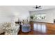 Bright living room features hardwood floors, shiplap accent wall, and plenty of seating at 210 Tifton Ln, Roswell, GA 30075