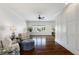 Bright living room features hardwood floors, shiplap accent wall, and plenty of seating at 210 Tifton Ln, Roswell, GA 30075