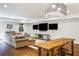 Open-concept living space with hardwood floors, sofa, and a wooden island is great for gatherings at 210 Tifton Ln, Roswell, GA 30075