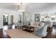 Open-concept living room flowing into the kitchen, offering a stylish and functional living space at 210 Tifton Ln, Roswell, GA 30075