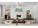 Bright living room with fireplace, shiplap walls, hardwood floors, and modern decor at 210 Tifton Ln, Roswell, GA 30075