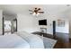 Comfortable main bedroom with hardwood floors, a ceiling fan, and an ensuite bathroom at 210 Tifton Ln, Roswell, GA 30075