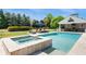 Backyard with a refreshing pool, a tanning deck with lounge chairs, and outdoor fireplace at 210 Tifton Ln, Roswell, GA 30075