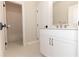 Bright bathroom featuring a white vanity with gold fixtures and a tiled shower/tub combo at 2381 Siskin Square Rd, Duluth, GA 30096