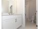 Bright bathroom featuring a white vanity with gold fixtures and a tiled shower/tub combo at 2381 Siskin Square Rd, Duluth, GA 30096