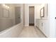 Bright bathroom featuring a glass-enclosed shower and double sink vanity at 2381 Siskin Square Rd, Duluth, GA 30096