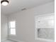 Bedroom featuring neutral colored walls and new windows allowing for natural light at 2381 Siskin Square Rd, Duluth, GA 30096