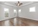 Bright, airy bedroom with recessed lighting, hardwood floors, and large windows at 2381 Siskin Square Rd, Duluth, GA 30096