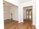 Light-filled foyer with hardwood flooring, modern lighting, and an open floor plan leading into the home at 2381 Siskin Square Rd, Duluth, GA 30096