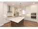 Modern kitchen featuring a center island, stainless steel appliances, and ample cabinet space at 2381 Siskin Square Rd, Duluth, GA 30096